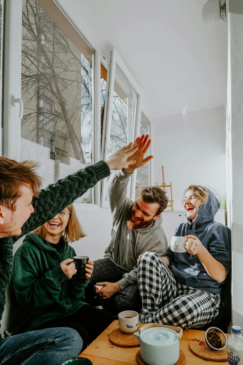Friends greeting each other over coffee
